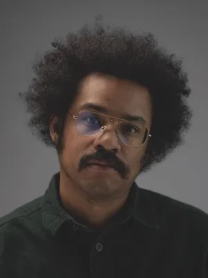 Headshot of James Goddard wearing glasses 